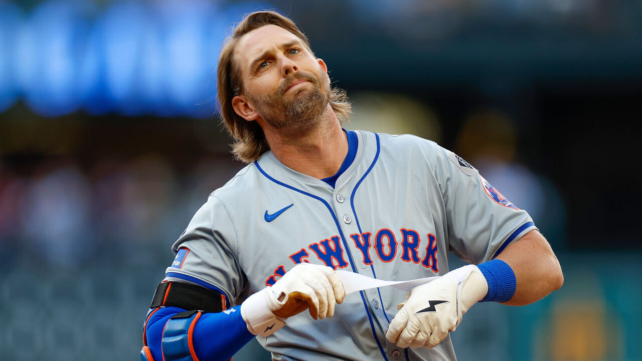 SEATTLE, WASHINGTON - AUGUST 11: Jeff McNeil #1 of the New York Mets removes his batting gloves after hitting a ground out in the eighth inning during a game against the Seattle Mariners at T-Mobile Park on August 11, 2024 in Seattle, Washington.