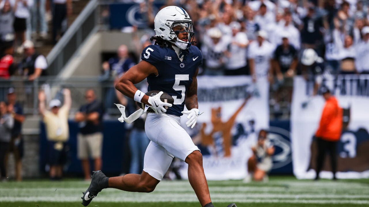STATE COLLEGE, PA - SEPTEMBER 07: Omari Evans #5 of the Penn State Nittany Lions scores a touchdown against the Bowling Green Falcons during the first half at Beaver Stadium on September 7, 2024 in State College, Pennsylvania.