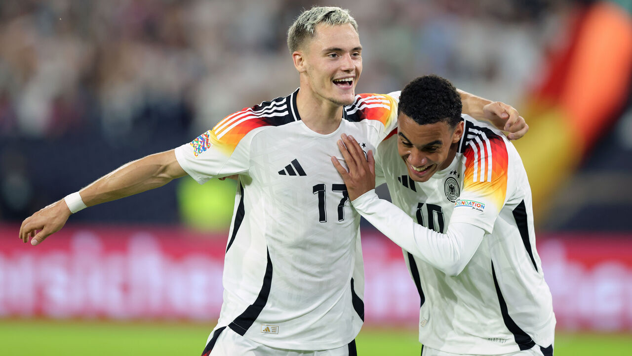DUESSELDORF, GERMANY - SEPTEMBER 7: (L.R:) Florian Wirtz and Jamal Musiala of Germany celebrate the third goal for Germany during the UEFA Nations League 2024/25 League A Group A3 match between Germany and Hungary at Merkur Spiel-Arena on September 7, 2024 in Duesseldorf, Germany.