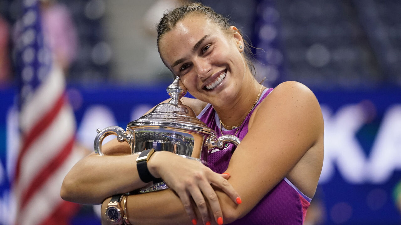 Belarus's Aryna Sabalenka holds the trophy after defeating USA's Jessica Pegula during their women's final match on day thirteen of the US Open tennis tournament at the USTA Billie Jean King National Tennis Center in New York City, on September 7, 2024.