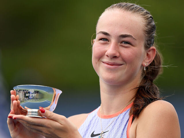 NEW YORK, NEW YORK - SEPTEMBER 07: Mika Stojsavljevic of Great Britain celebrates with her trophy after defeating Wakana Sonobe of Japan in their Junior Girls' Singles Final match on Day Thirteen of the 2024 US Open at USTA Billie Jean King National Tennis Center on September 07, 2024 in the Flushing neighborhood of the Queens borough of New York City.