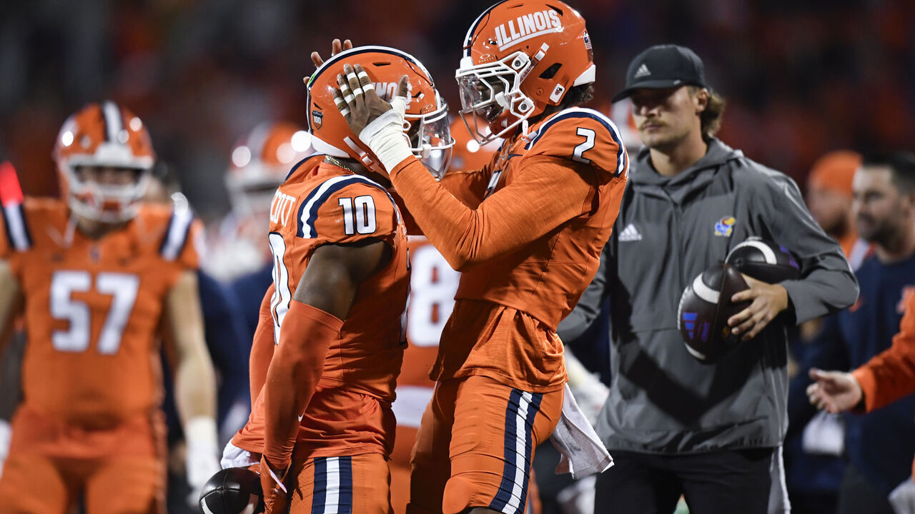 CHAMPAIGN, IL - SEPTEMBER 07: Illinois Fighting Illini Defensive Back Saboor Karriem (2) celebrates with Illinois Fighting Illini Defensive Back Miles Scott (10) during the college football game between the Kansas Jayhawks and the Illinois Fighting Illini on September 7, 2024, at Memorial Stadium in Champaign, Illinois.