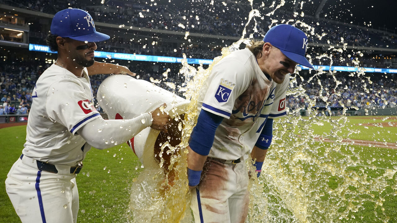 KANSAS CITY, MISSOURI - SEPTEMBER 07: Bobby Witt Jr. #7 of the Kansas City Royals is doused by MJ Melendez #1 of the Kansas City Royals after a 4-2 win over the Minnesota Twins at Kauffman Stadium on September 07, 2024 in Kansas City, Missouri.