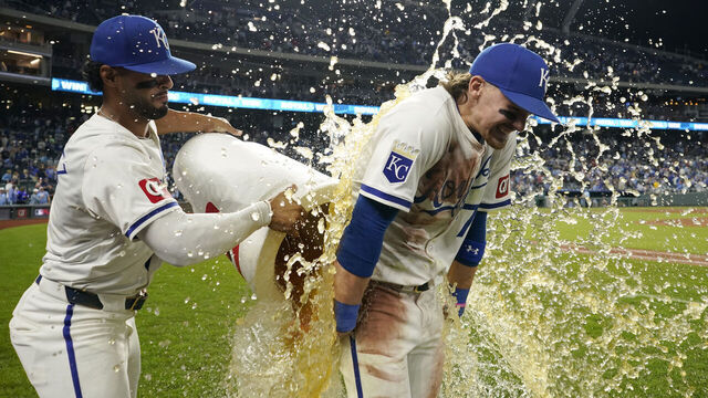 KANSAS CITY, MISSOURI - SEPTEMBER 07: Bobby Witt Jr. #7 of the Kansas City Royals is doused by MJ Melendez #1 of the Kansas City Royals after a 4-2 win over the Minnesota Twins at Kauffman Stadium on September 07, 2024 in Kansas City, Missouri.