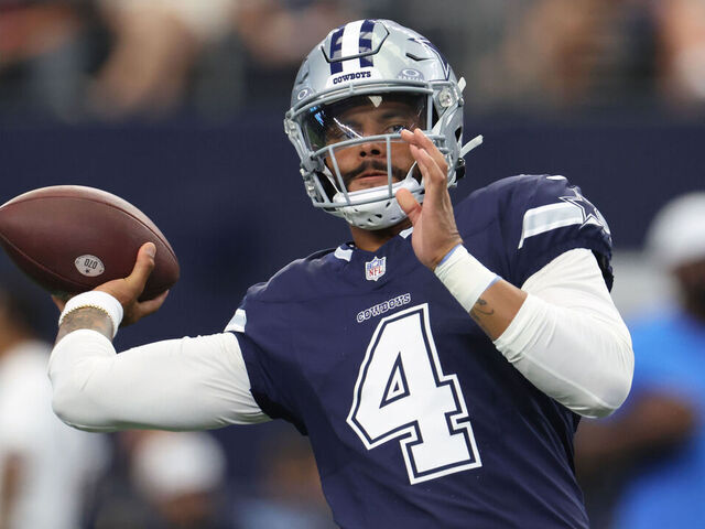 ARLINGTON, TX - AUGUST 24: Dak Prescott #4 of the Dallas Cowboys warms up before a preseason game between the Dallas Cowboys and the Los Angeles Chargers at AT&T Stadium on August 24, 2024 in Arlington, Texas.