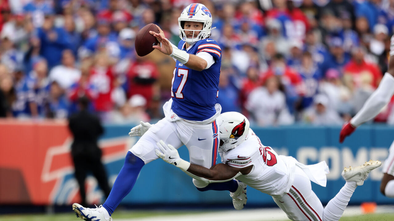 ORCHARD PARK, NEW YORK - SEPTEMBER 08: Krys Barnes #51 of the Arizona Cardinals tackles Josh Allen #17 of the Buffalo Bills during the second quarter at Highmark Stadium on September 08, 2024 in Orchard Park, New York.