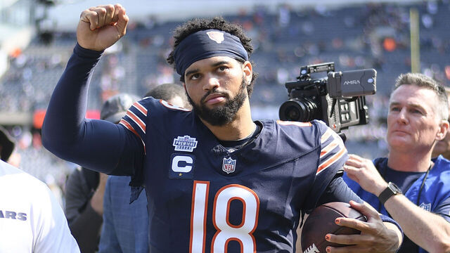 CHICAGO, ILLINOIS - SEPTEMBER 08: Caleb Williams #18 of the Chicago Bears celebrates after the game against the Tennessee Titans at Soldier Field on September 08, 2024 in Chicago, Illinois. The Bears defeated the Titans 24-17.