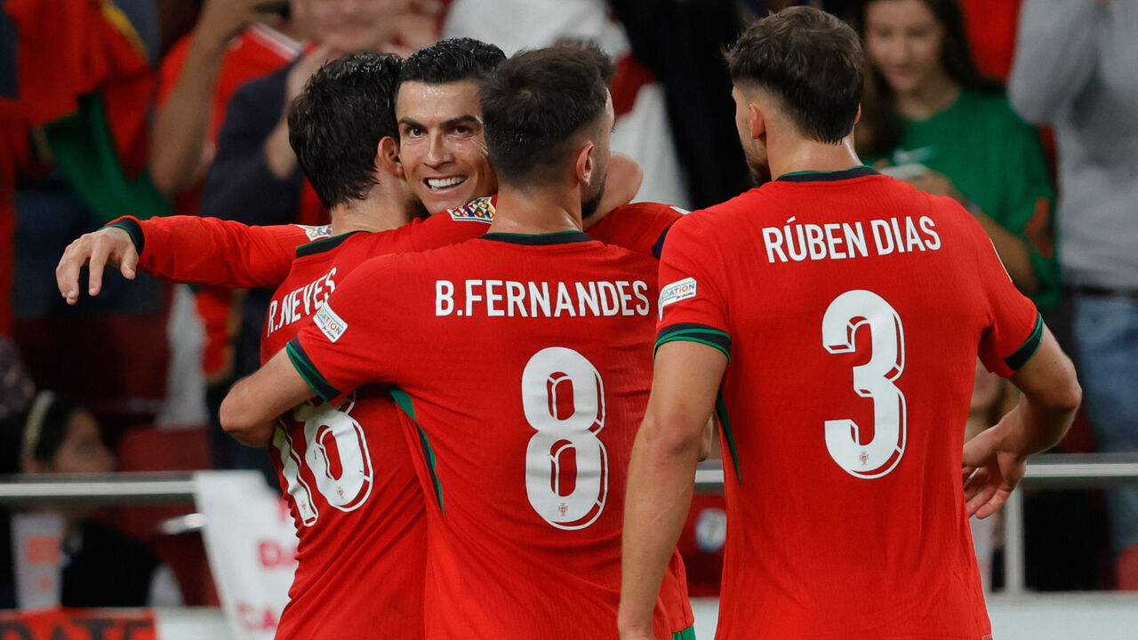 LISBON, PORTUGAL - SEPTEMBER 8: Cristiano Ronaldo of Portugal celebrates 2-1 with Ruben Neves of Portugal, Bruno Fernandes of Portugal, Ruben Dias of Portugal during the UEFA Nations league match between Portugal v Scotland at the Estadio Da Luz on September 8, 2024 in Lisbon Portugal