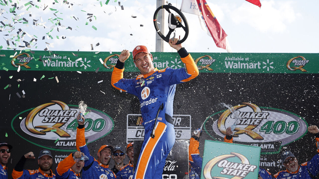 HAMPTON, GEORGIA - SEPTEMBER 08: Joey Logano, driver of the #22 Autotrader Ford, celebrates in victory lane after winning the NASCAR Cup Series Quaker State 400 Available at Walmart at Atlanta Motor Speedway on September 08, 2024 in Hampton, Georgia.