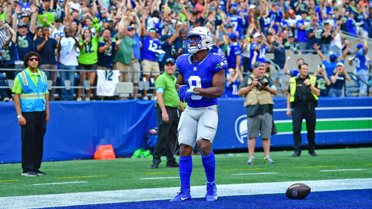 SEATTLE, WASHINGTON - SEPTEMBER 08: Kenneth Walker III #9 of the Seattle Seahawks reacts after scoring a rushing touchdown during the third quarter against the Denver Broncos at Lumen Field on September 08, 2024 in Seattle, Washington.
