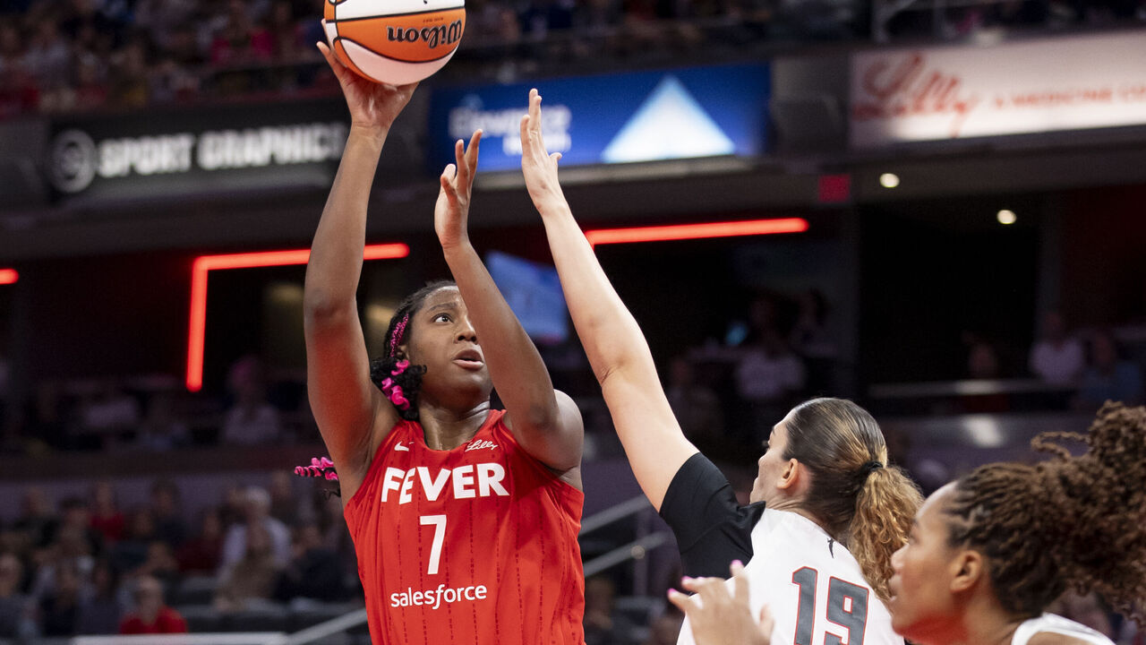 INDIANAPOLIS, INDIANA - SEPTEMBER 8: Aliyah Boston #7 of the Indiana Fever makes a basket while being defended by Lorela Cubaj in the second quarter at Gainbridge Fieldhouse on September 8, 2024 in Indianapolis, Indiana.