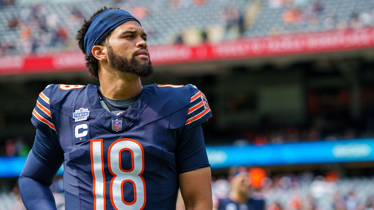 CHICAGO, ILLINOIS - SEPTEMBER 8: Quarterback Caleb Williams #18 of the Chicago Bears stretches prior to an NFL football game against the Tennessee Titans, Sunday, Sept. 8, 2024 in Chicago. (Todd Rosenberg via AP)