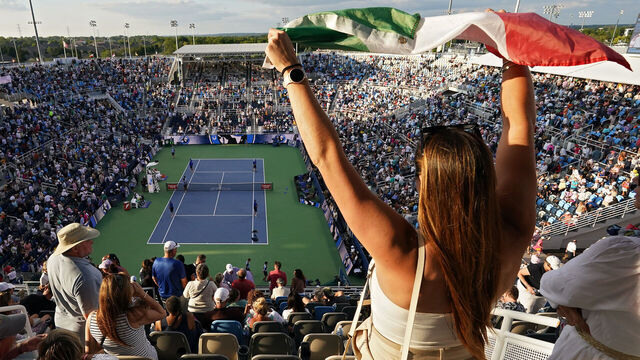 MASON, OHIO - AUGUST 19: A fan waves an Italian flag during the match between Frances Tiafoe of the United States and Jannik Sinner of Italy during the Final Day of the Cincinnati Open at the Lindner Family Tennis Center on August 19, 2024 in Mason, Ohio.