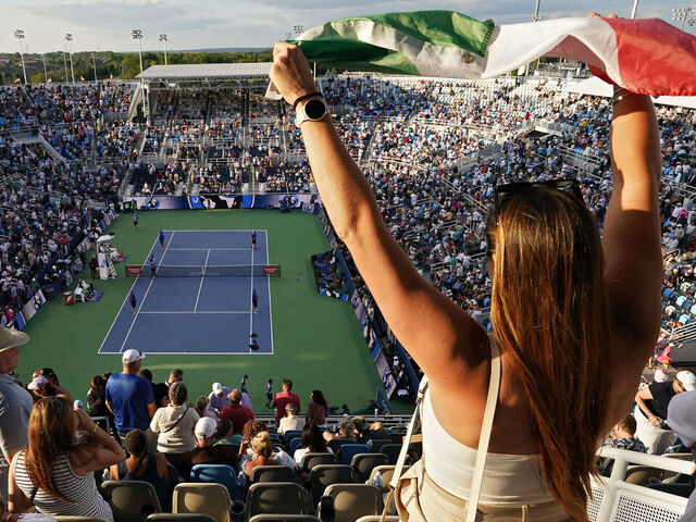 MASON, OHIO - AUGUST 19: A fan waves an Italian flag during the match between Frances Tiafoe of the United States and Jannik Sinner of Italy during the Final Day of the Cincinnati Open at the Lindner Family Tennis Center on August 19, 2024 in Mason, Ohio.