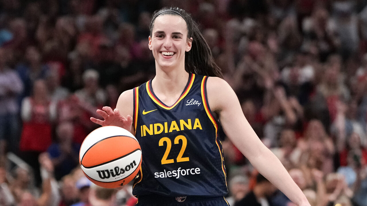 INDIANAPOLIS, INDIANA - SEPTEMBER 04: Caitlin Clark #22 of the Indiana Fever celebrates after recording a triple-double in the fourth quarter against the Los Angeles Sparks at Gainbridge Fieldhouse on September 04, 2024 in Indianapolis, Indiana.