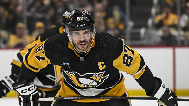 PITTSBURGH, PA - APRIL 15: Pittsburgh Penguins center Sidney Crosby (87) waits for a faceoff during the first period in the NHL game between the Pittsburgh Penguins and the Nashville Predators on April 15, 2024, at PPG Paints Arena in Pittsburgh, PA.