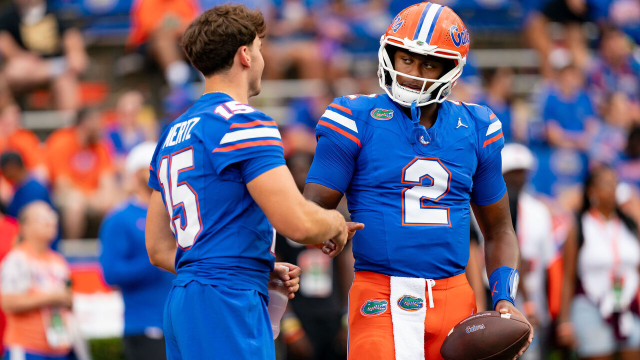 GAINESVILLE, FL - SEPTEMBER 07: Florida Gators quarterback DJ Lagway (2) and Florida Gators quarterback Graham Mertz (15) talk during warm ups before a college football game between the Samford Bulldogs and the Florida Gators on September 7th, 2024 at Ben Hill Griffin Stadium in Gainesville, FL.