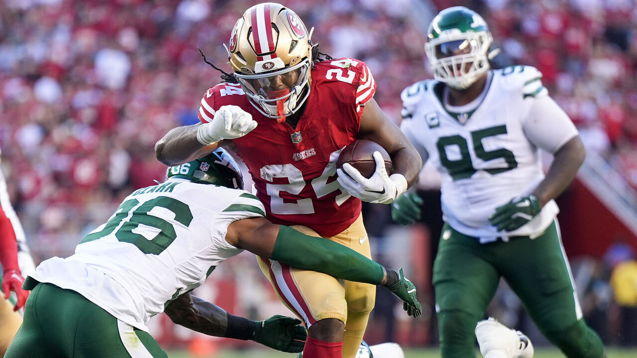 SANTA CLARA, CALIFORNIA - SEPTEMBER 09: Jordan Mason #24 of the San Francisco 49ers carries the ball against Chuck Clark #36 of the New York Jets during the first half at Levi's Stadium on September 09, 2024 in Santa Clara, California.