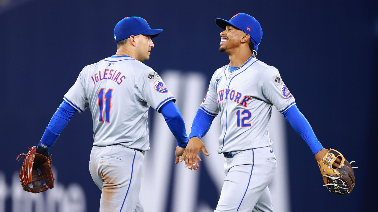 TORONTO, ON - SEPTEMBER 09: Francisco Lindor #12 and Jose Iglesias #11 of the New York Mets celebrate the win following a game against the Toronto Blue Jays at Rogers Centre on September 09, 2024 in Toronto, Ontario, Canada.
