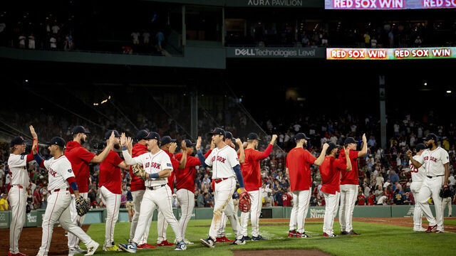 BOSTON, MASSACHUSETTS - AUGUST 28: Boston Red Sox players react after a win against the Toronto Blue Jays on August 28, 2024 at Fenway Park in Boston, Massachusetts.
