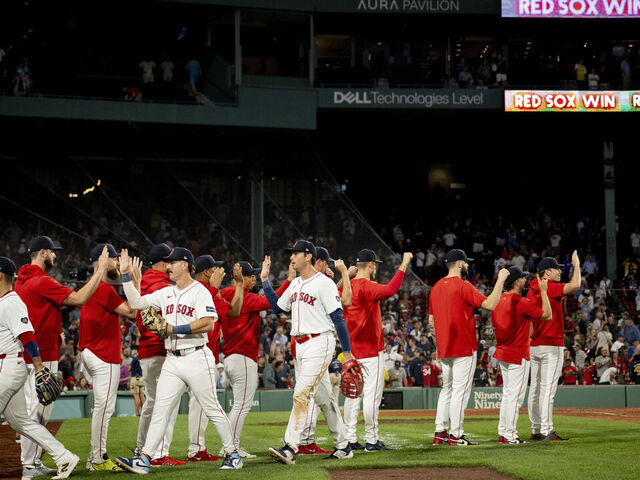 BOSTON, MASSACHUSETTS - AUGUST 28: Boston Red Sox players react after a win against the Toronto Blue Jays on August 28, 2024 at Fenway Park in Boston, Massachusetts.