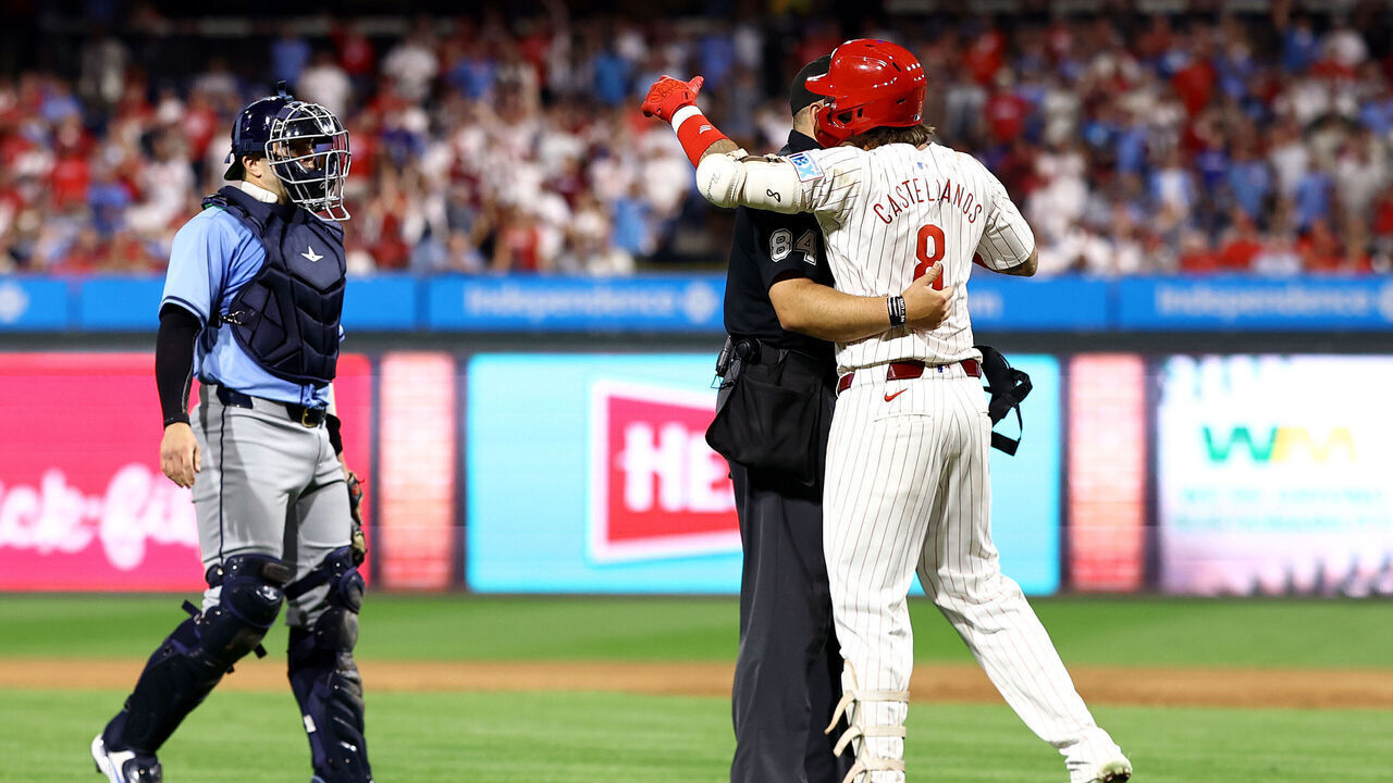 PHILADELPHIA, PENNSYLVANIA - SEPTEMBER 10: Nick Castellanos #8 of the Philadelphia Phillies reacts after being hit by a pitch during the eighth inning against the Tampa Bay Rays at Citizens Bank Park on September 10, 2024 in Philadelphia, Pennsylvania.