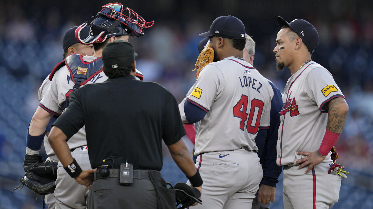 WASHINGTON, DC - SEPTEMBER 10: Reynaldo López #40 of the Atlanta Braves meets with teammates and training staff on the pitcher's mound during the first inning against the Washington Nationals at Nationals Park on September 10, 2024 in Washington, DC.