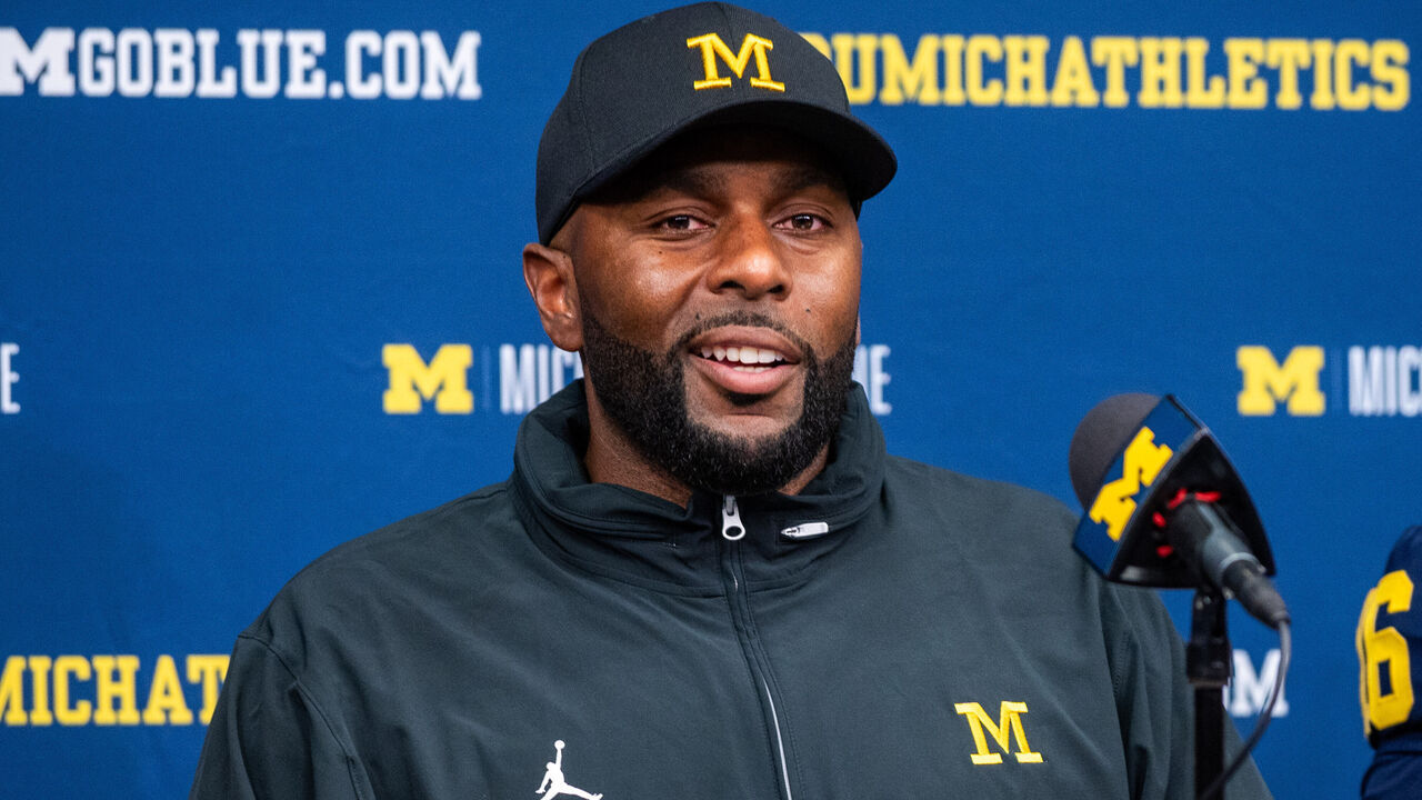 ANN ARBOR, MICHIGAN - AUGUST 31: Head Football Coach Sherrone Moore of the Michigan Wolverines speaks to media during the post game press conference after a college football game against the Fresno St. Bulldogs at Michigan Stadium on August 31, 2024 in Ann Arbor, Michigan. The Michigan Wolverines won the game 30-10.