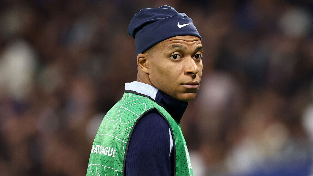 France's forward #10 Kylian Mbappe warms up ahead of the UEFA Nations League, League A - Group 2 first leg football match between France and Belgium at the Groupama Stadium in Decines-Charpieu, central-eastern France on September 9, 2024.