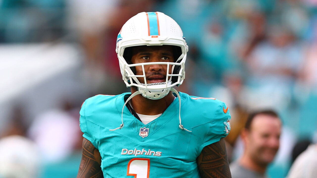 MIAMI GARDENS, FLORIDA - AUGUST 17: Tua Tagovailoa #1 of the Miami Dolphins looks on prior to a a preseason game against the Washington Commanders at Hard Rock Stadium on August 17, 2024 in Miami Gardens, Florida.
