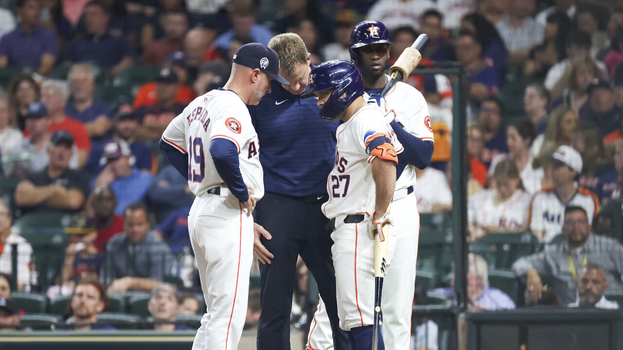 HOUSTON, TX - SEPTEMBER 11: (left to right) Houston Astros manager Joe Espada (19) checks on Houston Astros second baseman Jose Altuve (27) in the bottom of the fifth inning during the MLB game between the Oakland Athletics and Houston Astros on September 11, 2024 at Minute Maid Park in Houston, Texas.