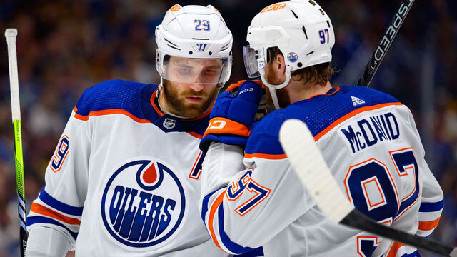 VANCOUVER, CANADA - MAY 16: Leon Draisaitl #29 and Connor McDavid #97 of the Edmonton Oilers talk during the second period in Game Five of the Second Round of the 2024 Stanley Cup Playoffs against the Vancouver Canucks at Rogers Arena on May 16, 2024 in Vancouver, British Columbia, Canada.