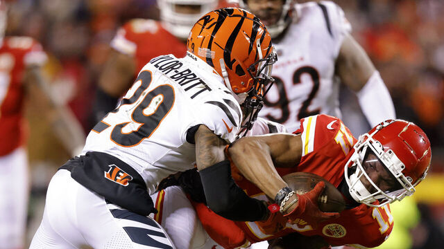 KANSAS CITY, MISSOURI - JANUARY 29: Cam Taylor-Britt #29 of the Cincinnati Bengals tackles Marquez Valdes-Scantling #11 of the Kansas City Chiefs during the third quarter in the AFC Championship Game at GEHA Field at Arrowhead Stadium on January 29, 2023 in Kansas City, Missouri.