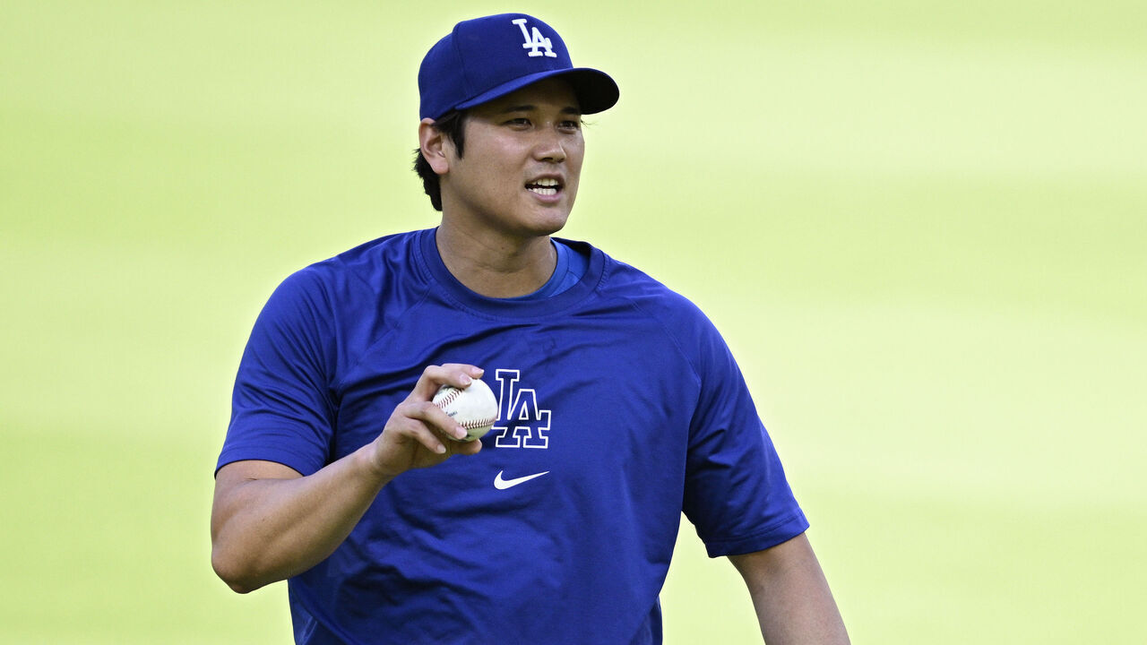 SAN DIEGO, CALIFORNIA - JULY 30: Shohei Ohtani #17 of the Los Angeles Dodgers throws in the outfield before the game against the San Diego Padres at Petco Park on July 30, 2024 in San Diego, California.