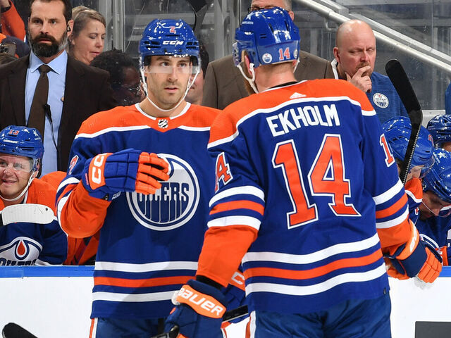 EDMONTON, CANADA - OCTOBER 21: Evan Bouchard #2 and Mattias Ekholm #14 of the Edmonton Oilers discuss the play during the game against the Winnipeg Jets at Rogers Place on October 21, 2023, in Edmonton, Alberta, Canada.