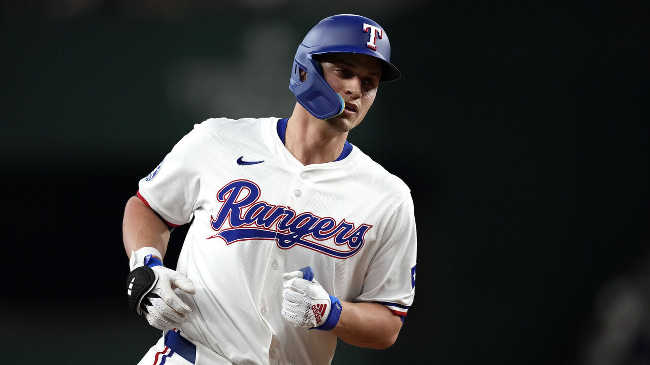 ARLINGTON, TEXAS - AUGUST 19: Corey Seager #5 of the Texas Rangers runs the bases on his solo home run during the first inning against the Pittsburgh Pirates at Globe Life Field on August 19, 2024 in Arlington, Texas.