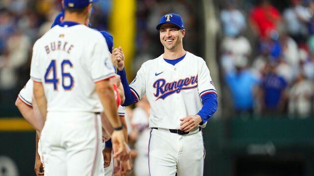 ARLINGTON, TX - MARCH 28: Jacob deGrom #48 of the Texas Rangers greets teammates on the field prior to the game between the Chicago Cubs and the Texas Rangers at Globe Life Field on Thursday, March 28, 2024 in Arlington, Texas.