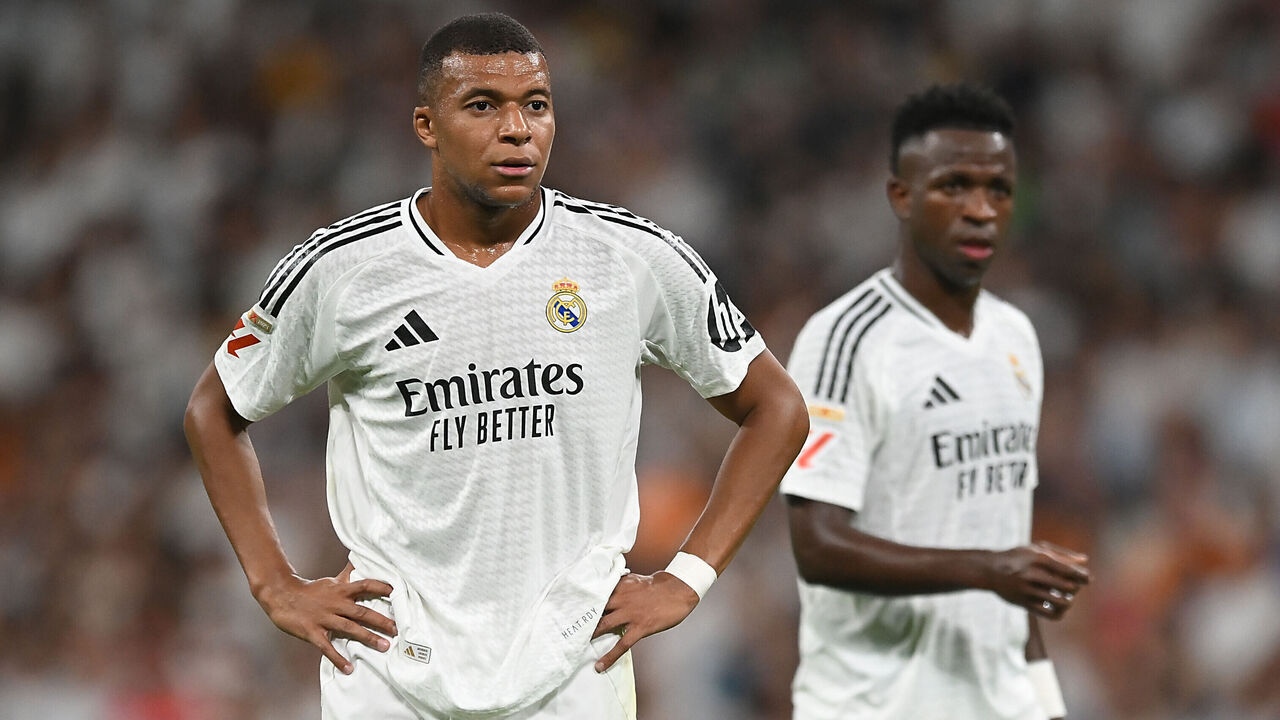 MADRID, SPAIN - SEPTEMBER 01: Kylian Mbappe of Real Madrid looks on with teammate Vinicius Junior during the LaLiga match between Real Madrid CF and Real Betis Balompie at Estadio Santiago Bernabeu on September 01, 2024 in Madrid, Spain.