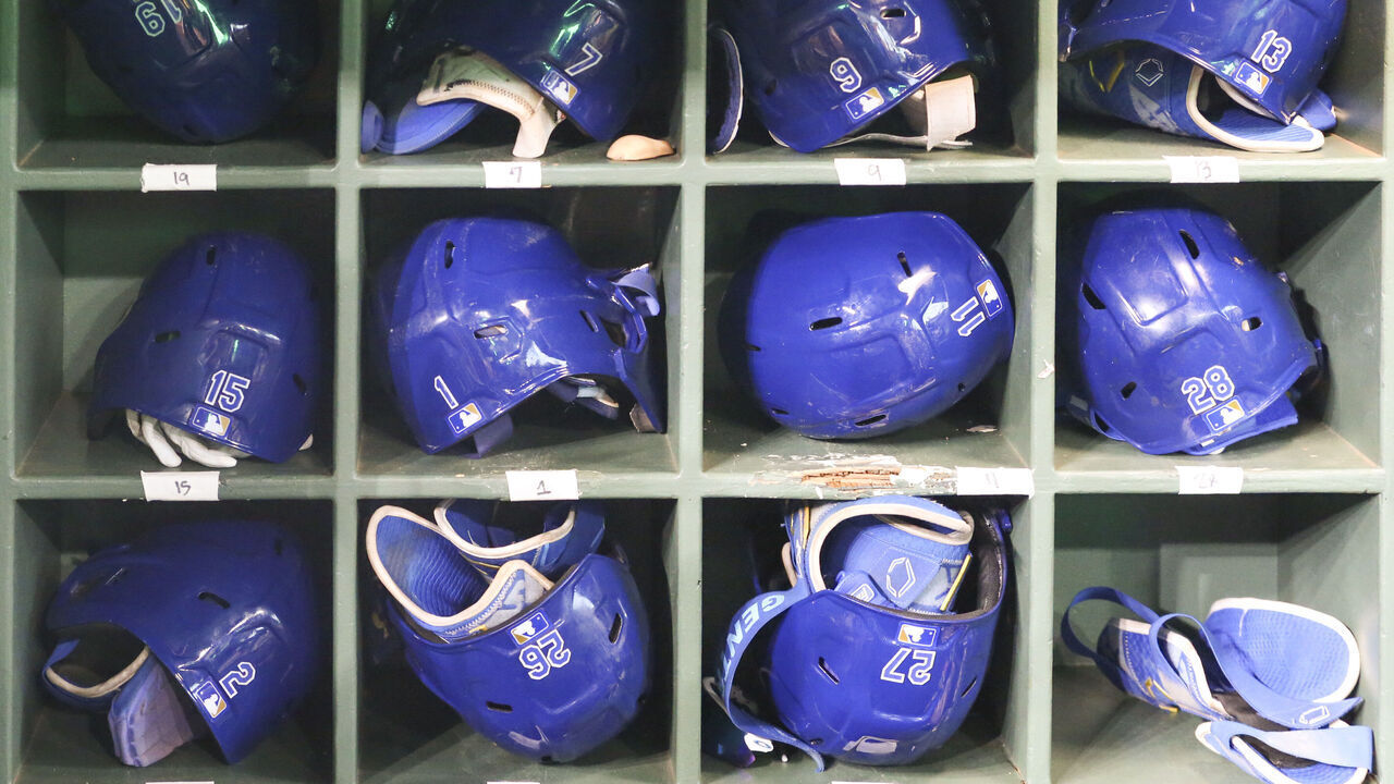 HOUSTON, TX - AUGUST 29: Kansas City Royals batting helmets are stored in the visitors' dugout during the MLB game between the Kansas City Royals and Houston Astros on August 29, 2024 at Minute Maid Park in Houston, Texas.