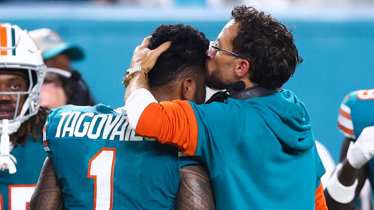 MIAMI GARDENS, FLORIDA - SEPTEMBER 12: (EDITORS NOTE: Retransmission with alternate crop.) Head coach Mike McDaniel of the Miami Dolphins embraces Tua Tagovailoa #1 after leaving the game with an injury during the third quarter against the Buffalo Bills at Hard Rock Stadium on September 12, 2024 in Miami Gardens, Florida.