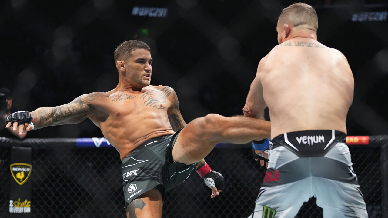 SALT LAKE CITY, UTAH - JULY 29: (L-R) Dustin Poirier in a lightweight fight for the BMF belt during the UFC 291 event at Delta Center on July 29, 2023 in Salt Lake City, Utah.