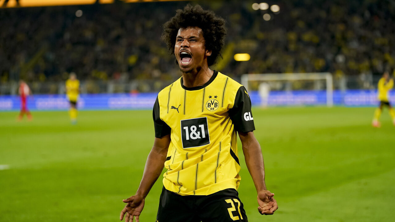 Dortmund, Germany - September 13: Karim Adeyemi of Borussia Dortmund celebrates after scoring his team's second goal during the Bundesliga match between Borussia Dortmund and 1. FC Heidenheim 1846 at Signal Iduna Park on September 13, 2024 in Dortmund, Germany.