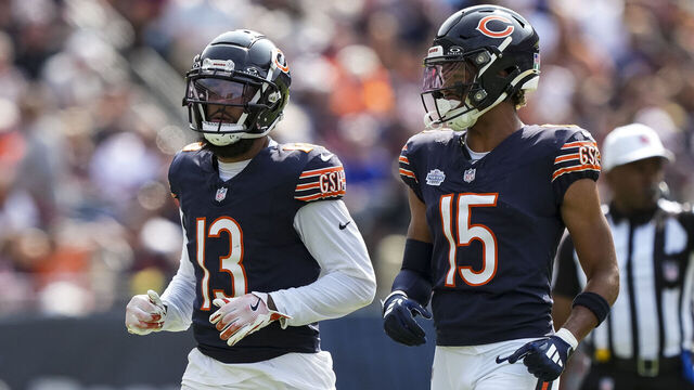 CHICAGO, IL - SEPTEMBER 8: Wide receiver Keenan Allen #13 of the Chicago Bears and wide receiver Rome Odunze #15 get set during the fourth quarter of an NFL football game against the Tennessee Titans, at Soldier Field on September 8, 2024 in Chicago, Illinois.