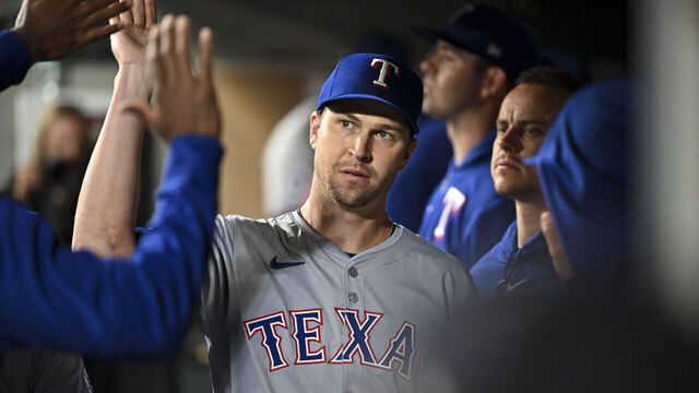 SEATTLE, WASHINGTON - SEPTEMBER 13: Jacob deGrom #48 of the Texas Rangers high-fives teammates after coming out of the game during the fourth inning against the Seattle Mariners at T-Mobile Park on September 13, 2024 in Seattle, Washington.
