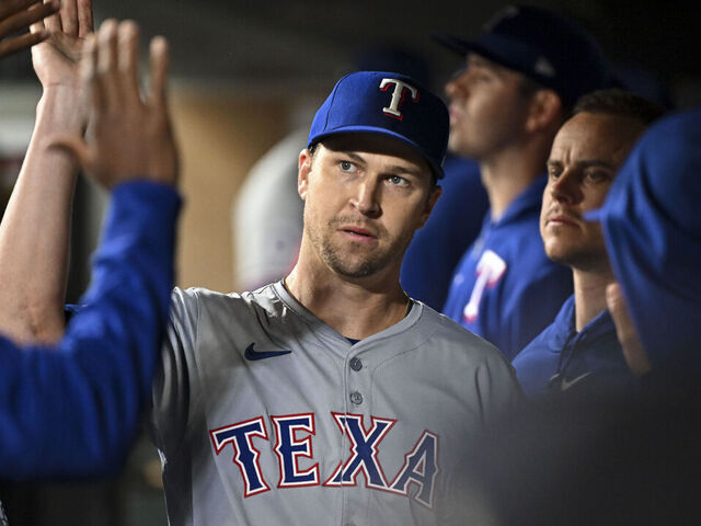 SEATTLE, WASHINGTON - SEPTEMBER 13: Jacob deGrom #48 of the Texas Rangers high-fives teammates after coming out of the game during the fourth inning against the Seattle Mariners at T-Mobile Park on September 13, 2024 in Seattle, Washington.