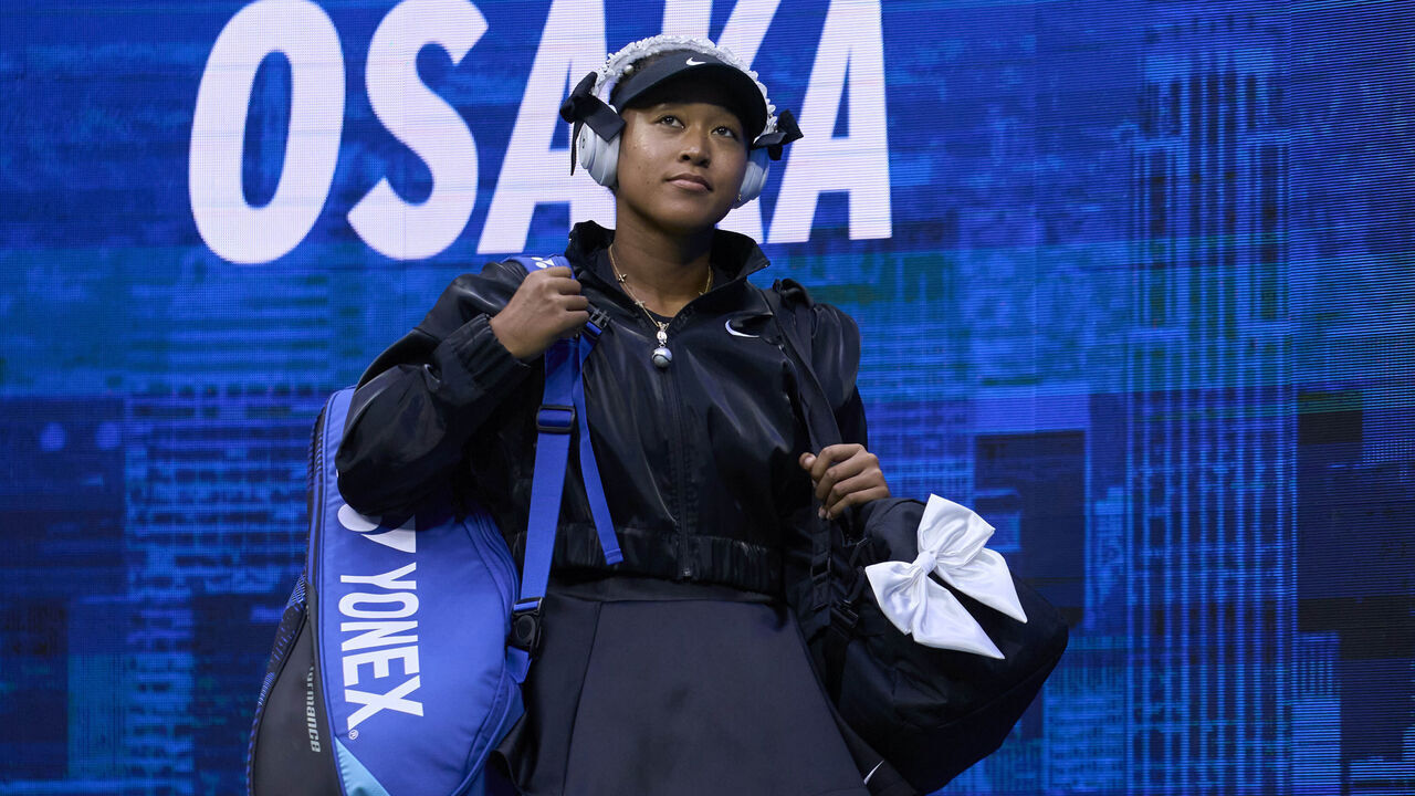 NEW YORK, NEW YORK - AUGUST 29: Naomi Osaka of Japan looks at the crowd as she enters the court in a black version of her Japanese inspired tennis attire prior to her Women's Singles Second Round match against Karolina Muchova of the Czech Republic on Day 4 of the US Open Arthur Ashe stadium at USTA Billie Jean King National Tennis Center on August 29, 2024 in New York City.