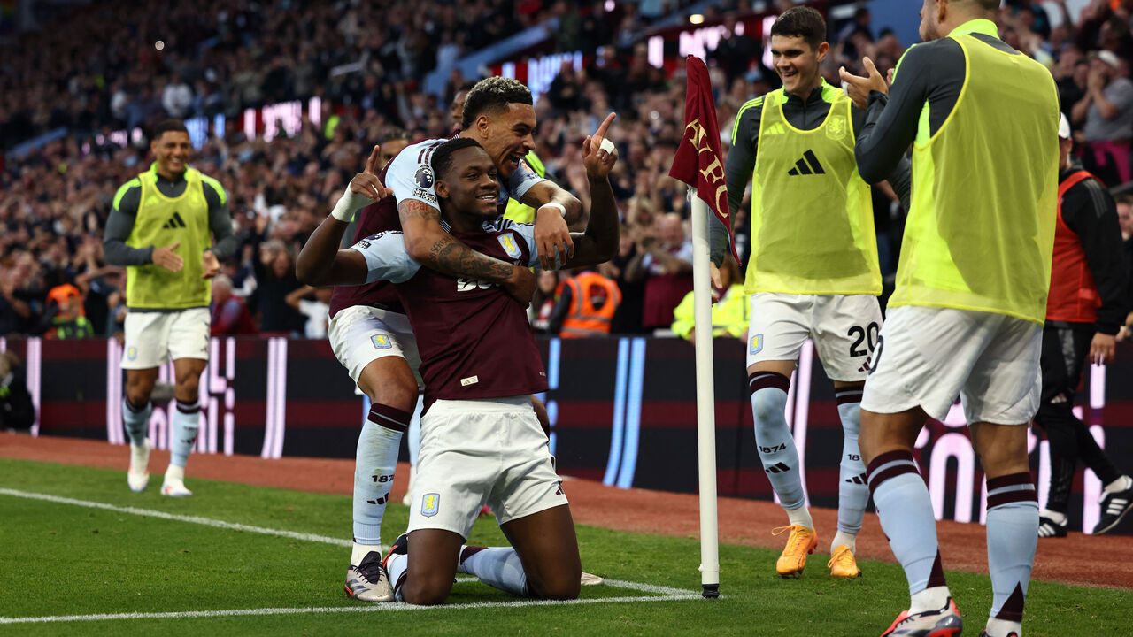 Aston Villa's Columbian striker #09 Jhon Duran celebrates with Aston Villa's English midfielder #27 Morgan Rogers (back) after scoring his team's third goal during the English Premier League football match between Aston Villa and Everton at Villa Park in Birmingham, central England on September 14, 2024.