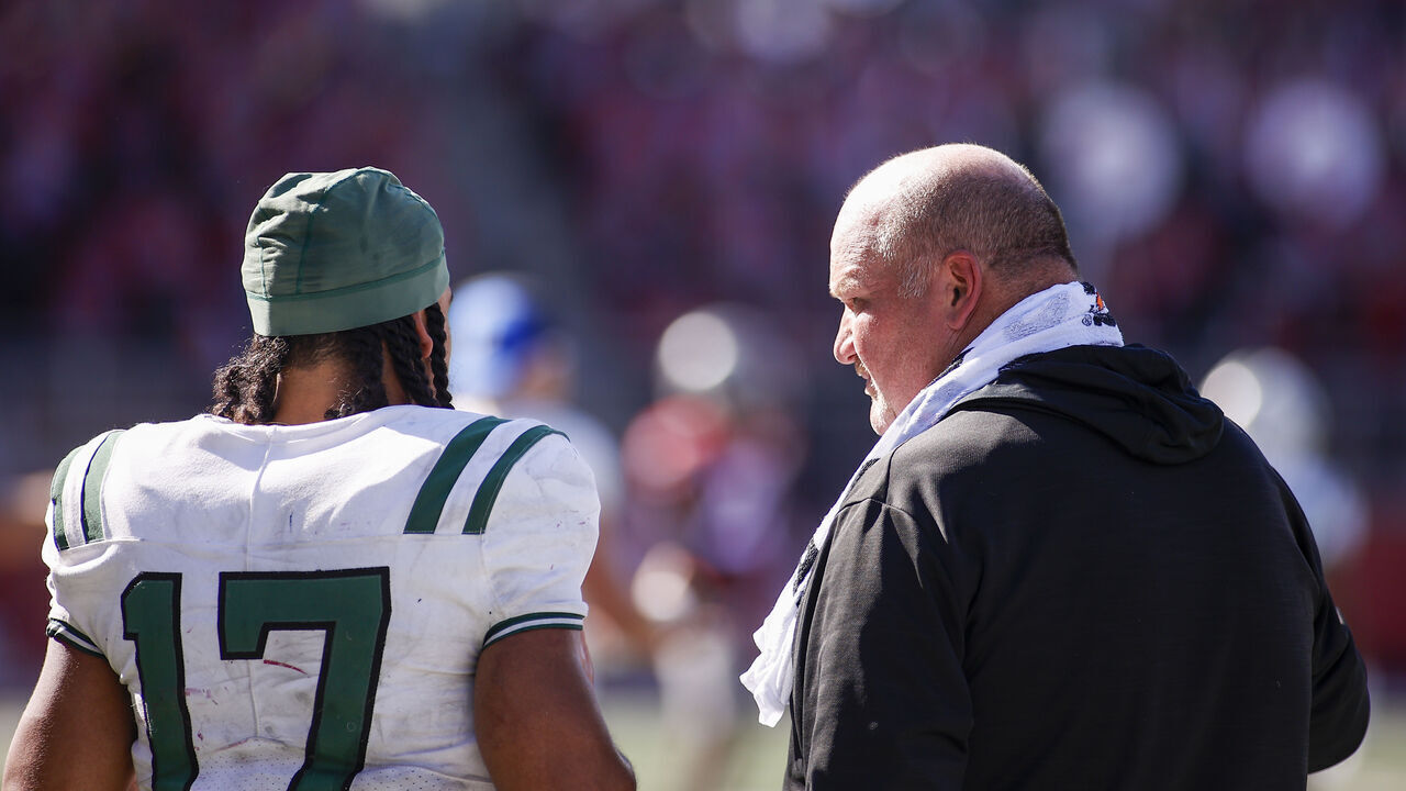 PULLMAN, WA - AUGUST 31: Portland State Vikings head coach Bruce Barnum talks with Portland State Vikings running back Quincy Craig (17) on the sideline during the game between the Portland State Vikings and the Washington State Cougars on August 31, 2024, at Martin Stadium in Pullman, WA.