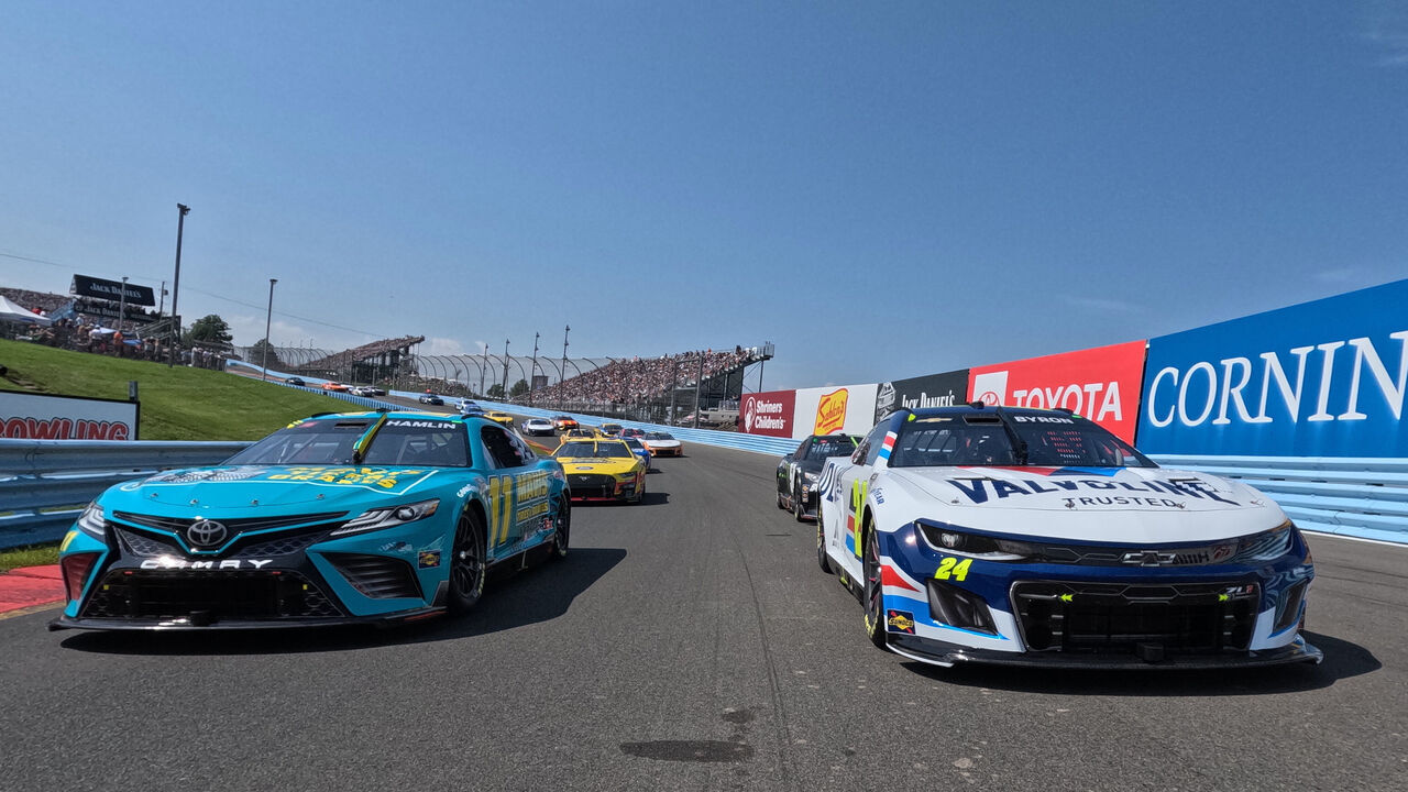 WATKINS GLEN, NEW YORK - AUGUST 20: Denny Hamlin, driver of the #11 Mavis Tires & Brakes Toyota, and William Byron, driver of the #24 Valvoline Chevrolet, lead the field on a pace lap prior to the NASCAR Cup Series Go Bowling at The Glen at Watkins Glen International on August 20, 2023 in Watkins Glen, New York.