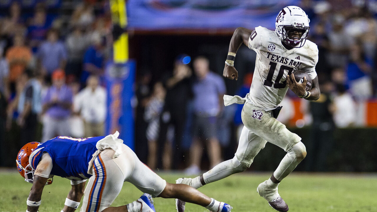 GAINESVILLE, FLORIDA - SEPTEMBER 14: Marcel Reed #10 of the Texas A&M Aggies runs with the ball during the second half of a game against the Florida Gators at Ben Hill Griffin Stadium on September 14, 2024 in Gainesville, Florida.